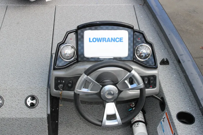 Slide: The Image of 2022 G3 Sportsman 1710 boat dashboard with Lowrance display and steering wheel. - 11