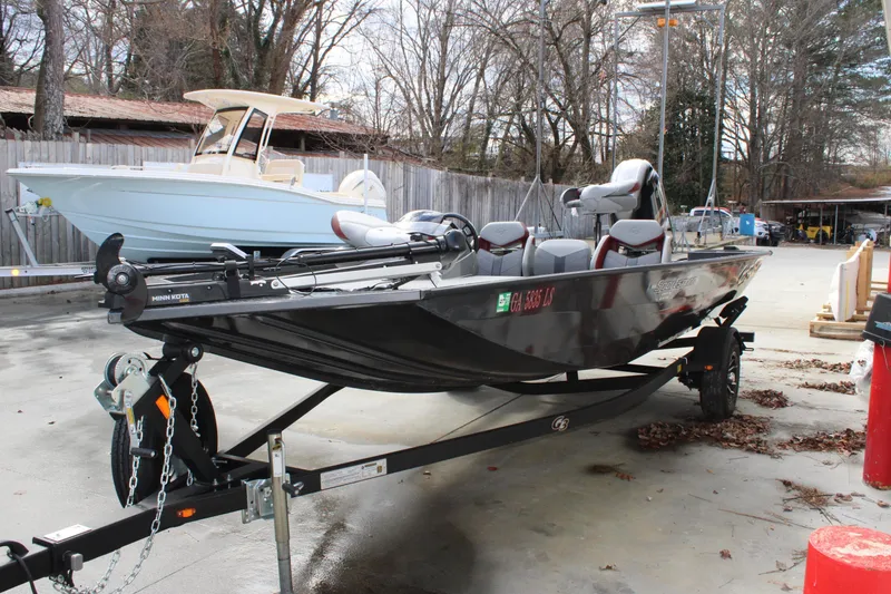 Slide: The Image of 2022 G3 Sportsman 1710 boat on trailer in outdoor setting. - 3