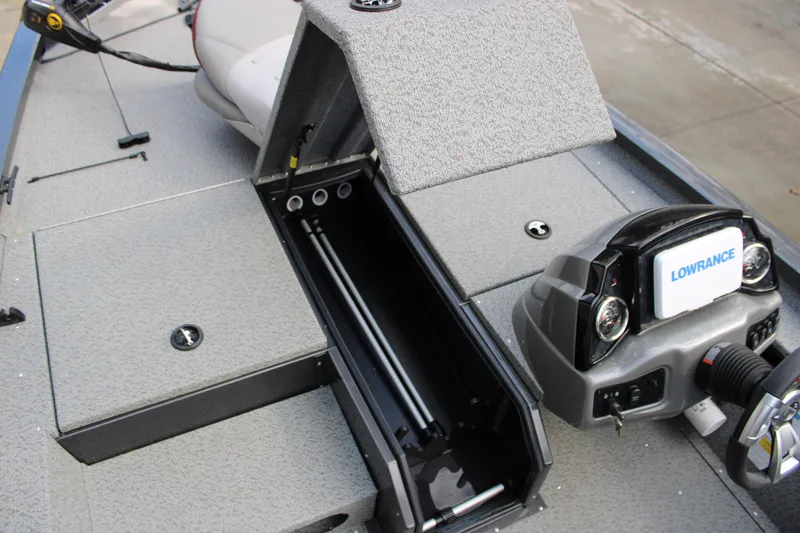 Slide: The Image of 2022 G3 Sportsman 1710 boat interior with storage compartment and Lowrance navigation system. - 6