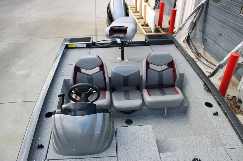 Slide: The Image of 2022 G3 Sportsman 1710 boat interior with three seats and steering wheel. - 9