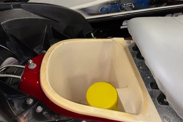 Slide: The Image of 2009 Yamaha WaveRunner FX Cruiser SHO storage compartment with yellow cap inside. - 14