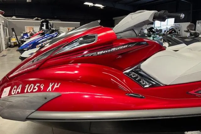 Slide: The Image of 2009 Yamaha WaveRunner FX Cruiser SHO in vibrant red, displayed indoors. - 4