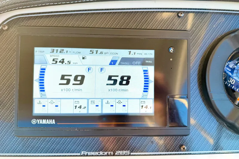 Slide: The Image of Dashboard of 2019 Grady-White Freedom 285 showing speed and engine data. - 10