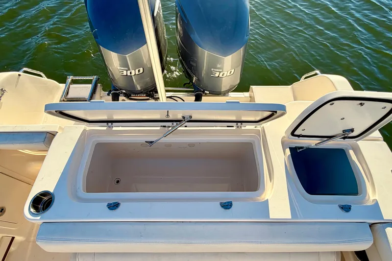 Slide: The Image of 2019 Grady-White Freedom 285 boat with Yamaha 300 engines, open storage compartments. - 17
