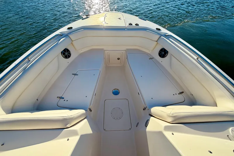 Slide: The Image of 2019 Grady-White Freedom 285 boat interior with spacious seating and storage. - 26