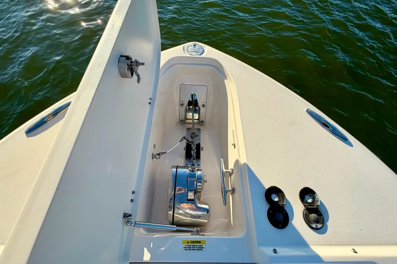 Slide: The Image of 2019 Grady-White Freedom 285 boat anchor compartment on calm water. - 29