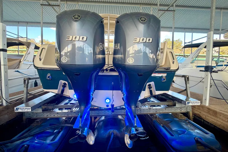 Slide: The Image of 2019 Grady-White Freedom 285 boat with dual Yamaha 300 engines on a lift. - 34
