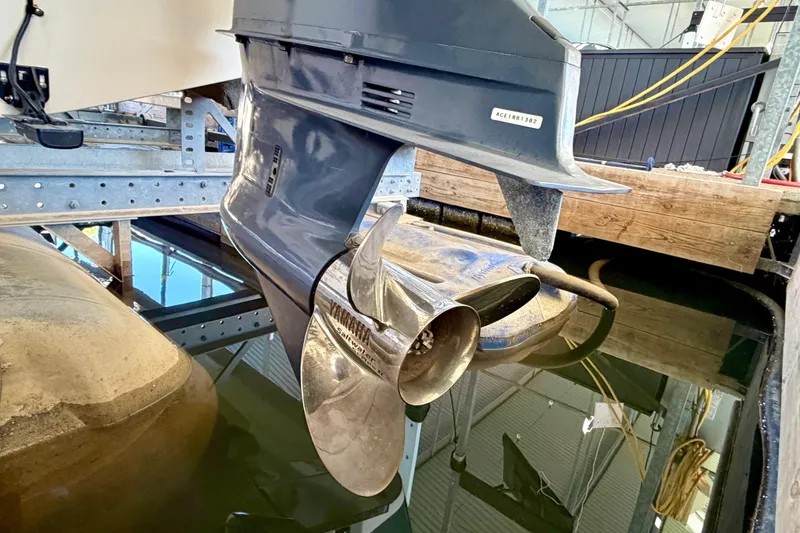Slide: The Image of 2019 Grady-White Freedom 285 boat propeller in a marina setting. - 37