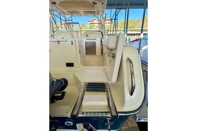 Slide: The Image of 2019 Grady-White Freedom 285 boat interior with seating and stainless steel details. - 39