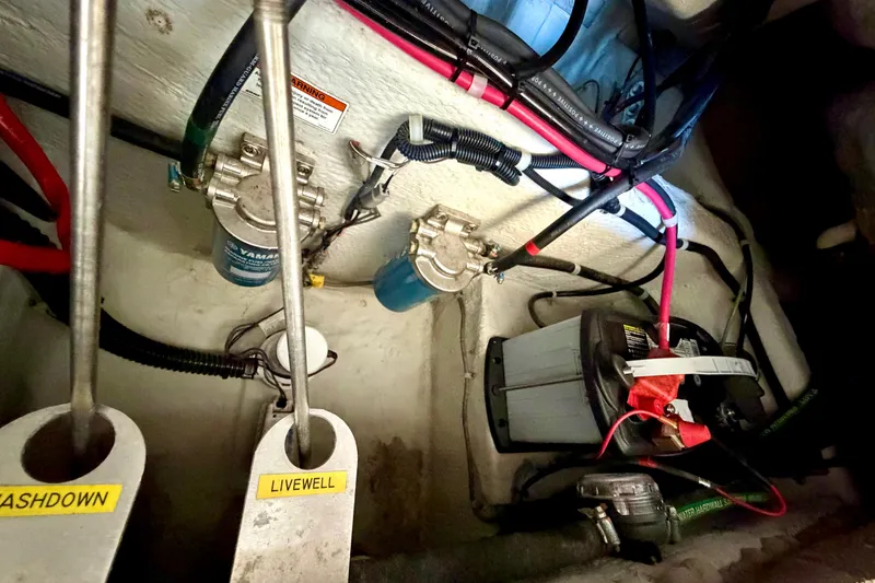 Slide: The Image of 2019 Grady-White Freedom 285 boat wiring and battery compartment with labeled components. - 44