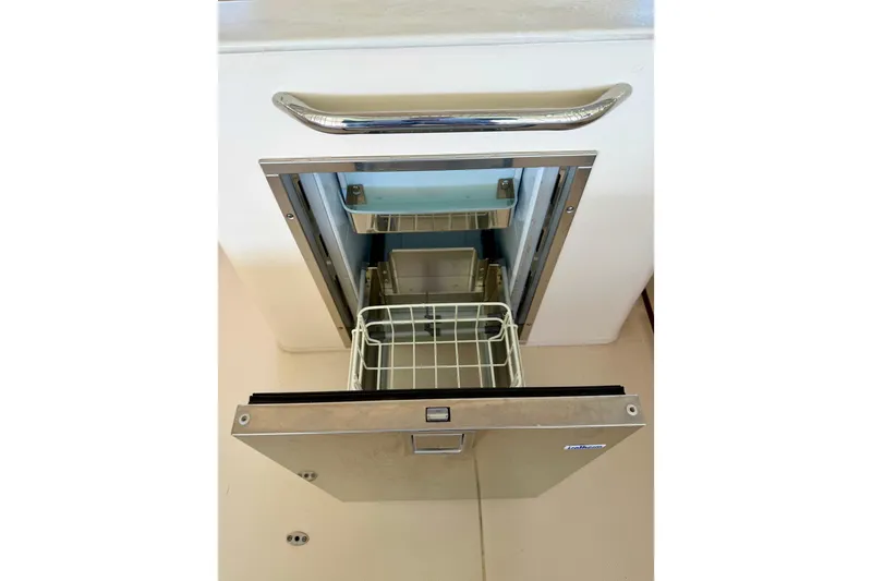 Slide: The Image of Open drawer refrigerator on 2019 Grady-White Freedom 285 boat. - 46