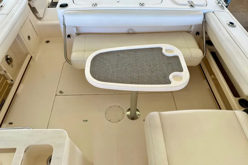 Slide: The Image of 2019 Grady-White Freedom 285 boat interior with seating and table setup. - 47