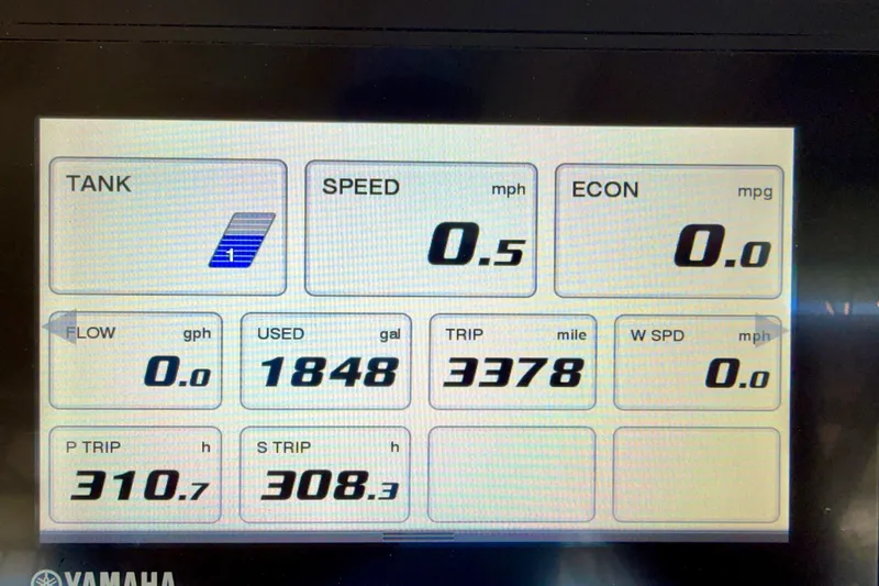 Slide: The Image of Dashboard display of a 2019 Grady-White Freedom 285 boat showing fuel and trip data. - 53