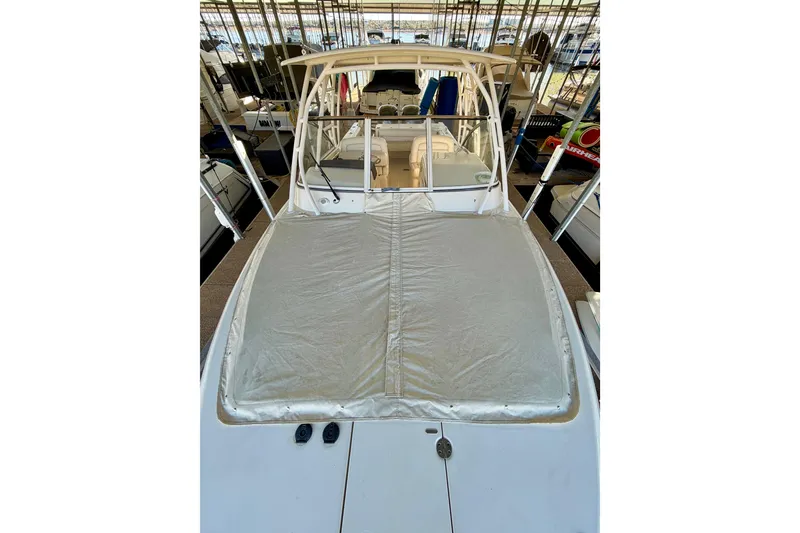 Slide: The Image of 2019 Grady-White Freedom 285 boat with covered deck in marina. - 60