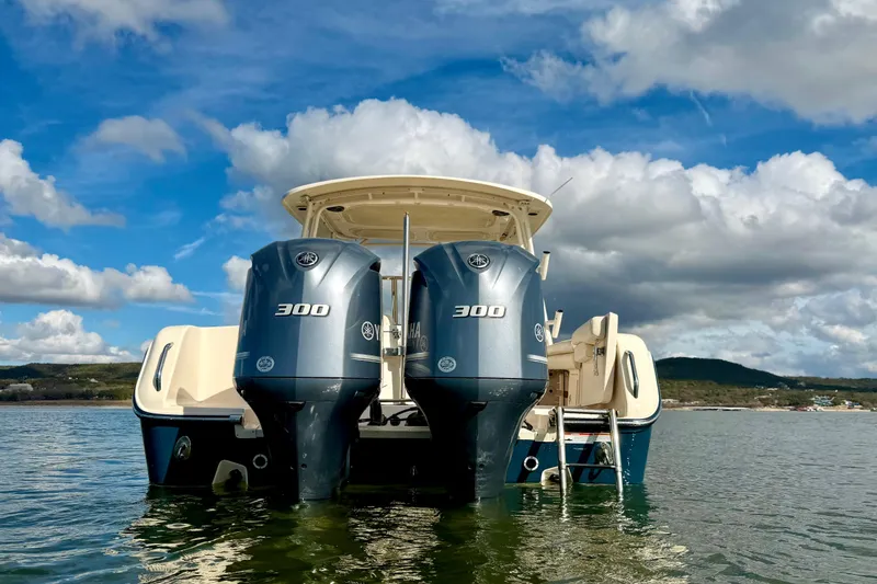 Slide: The Image of 2019 Grady-White Freedom 285 boat with twin Yamaha 300 engines on water. - 8