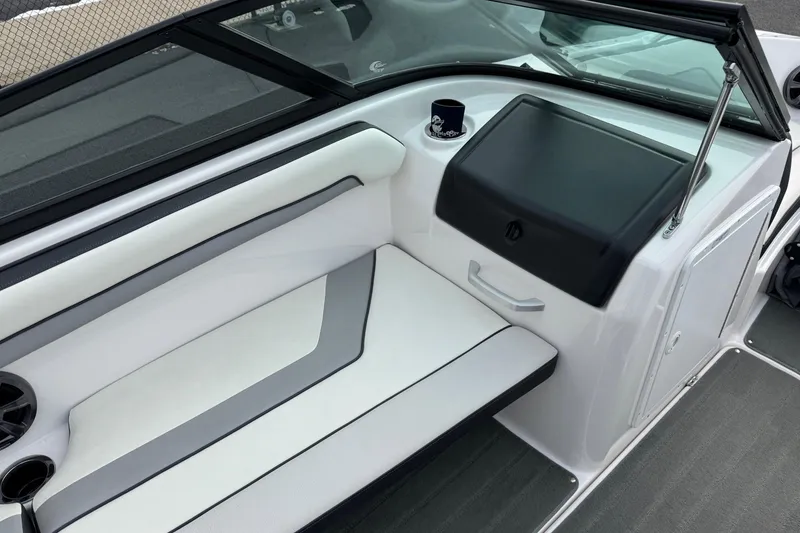 Slide: The Image of 2017 Yamaha AR195 boat interior with white seating and black dashboard. - 10