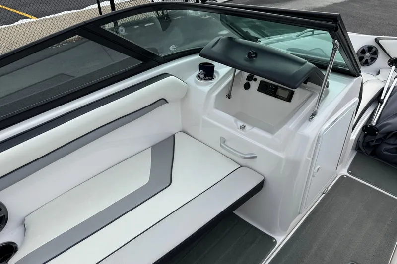 Slide: The Image of 2017 Yamaha Boats AR195 interior with seating, cup holder, and control panel. - 11