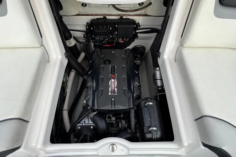 Slide: The Image of Engine compartment of a 2017 Yamaha Boats AR195, showcasing the powerful engine setup. - 16