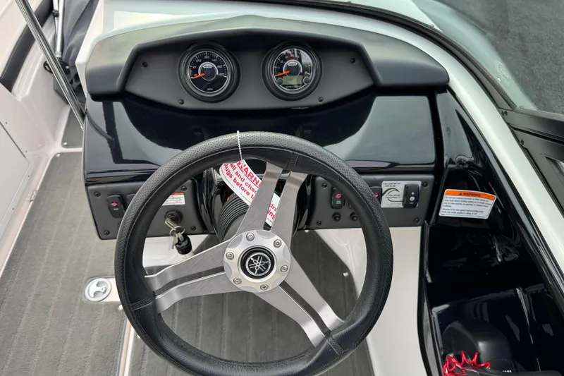 Slide: The Image of 2017 Yamaha Boats AR195 dashboard with steering wheel and instrument panel. - 8