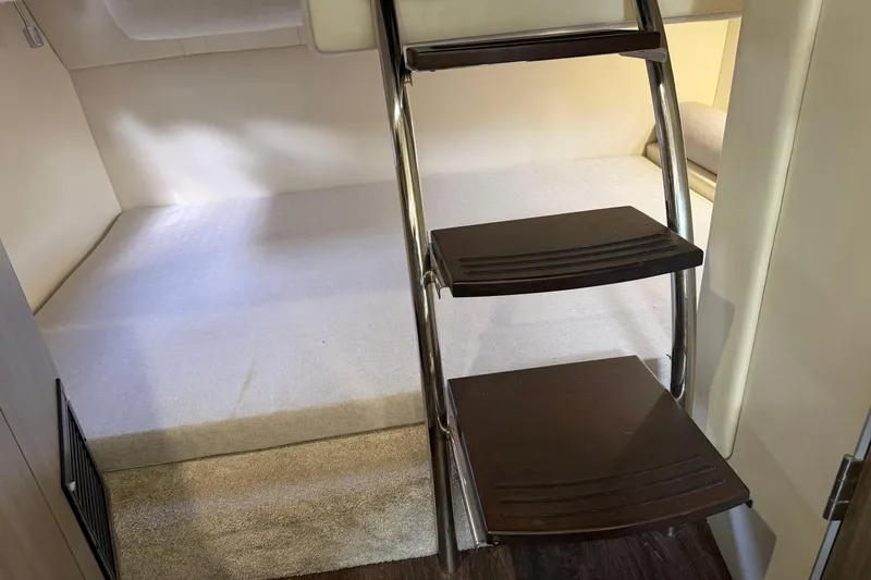 Slide: The Image of Interior cabin of 2021 Regal 26 XO boat with ladder and bed. - 20