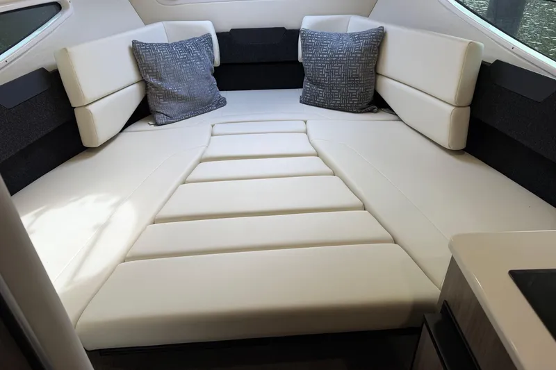 Slide: The Image of Luxurious interior of 2021 Regal 26 XO boat with plush seating and cushions. - 21