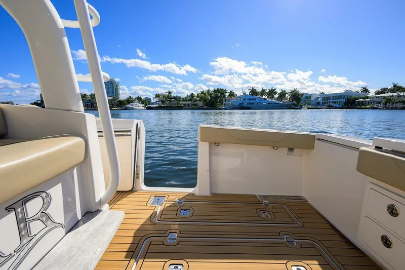 Slide: The Image of 2018 Pursuit S 408 Sport boat interior with scenic waterfront view. - 23