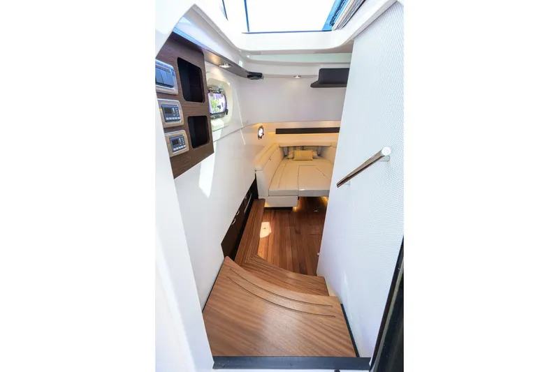 Slide: The Image of Interior cabin of 2018 Pursuit S 408 Sport boat with wooden flooring and modern design. - 29