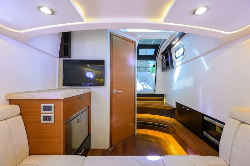 Slide: The Image of Luxurious interior of 2018 Pursuit S 408 Sport boat with modern amenities and wood finishes. - 31