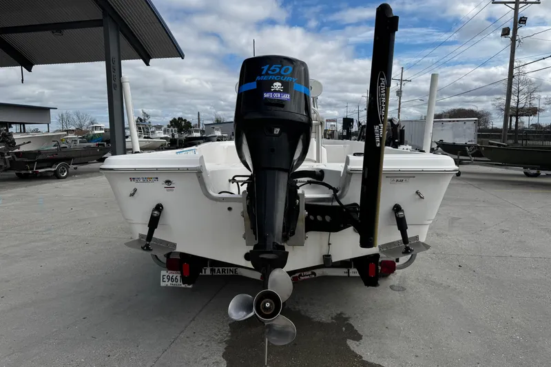 Slide: The Image of 2005 Sea Fox 205 Bay Fisher boat with Mercury 150 engine at a marina. - 12