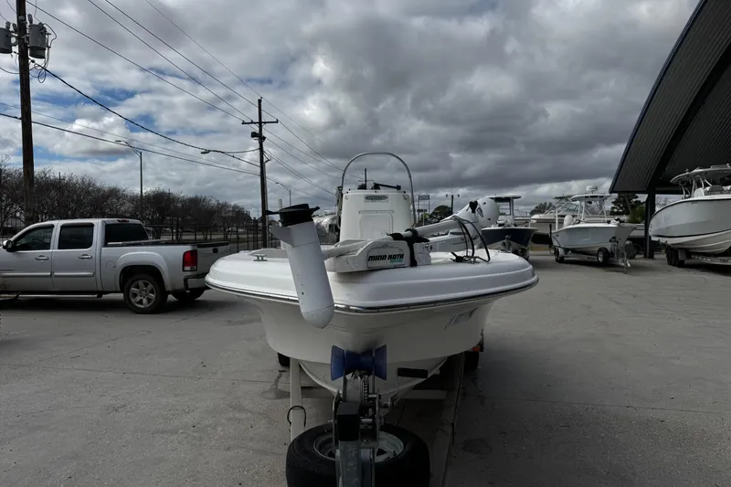 Slide: The Image of 2005 Sea Fox 205 Bay Fisher boat on trailer, parked outdoors under cloudy sky. - 13