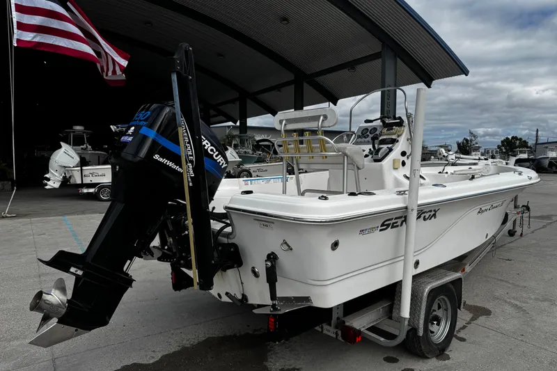 Slide: The Image of 2005 Sea Fox 205 Bay Fisher boat on trailer with Mercury outboard motor. - 3