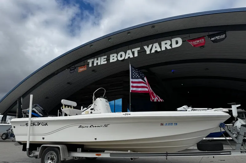 Slide: The Image of 2005 Sea Fox 205 Bay Fisher boat at The Boat Yard with American flag. - 8