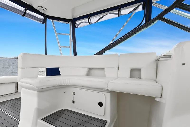 Slide: The Image of 2005 Tiara Open Classic boat interior with white seating and ocean view. - 12