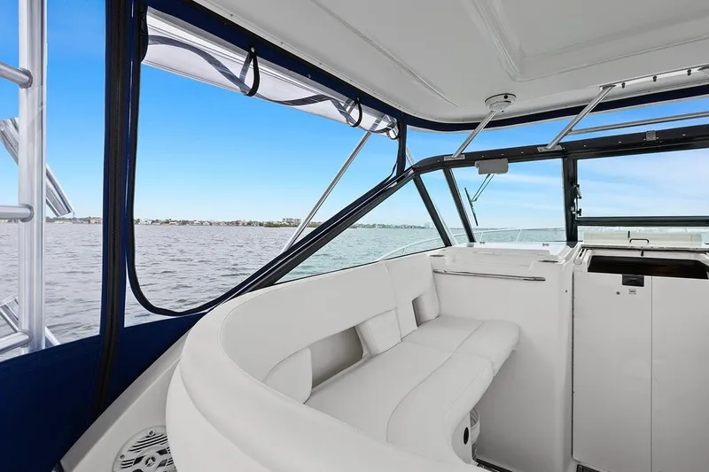 Slide: The Image of 2005 Tiara Open Classic boat interior with white seating and ocean view. - 13