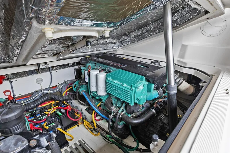 Slide: The Image of Engine compartment of a 2005 Tiara Open Classic boat, showcasing detailed wiring and components. - 25