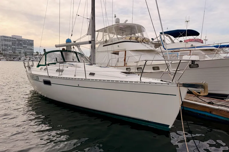 The Image of 1997 Beneteau Oceanis 351 sailboat docked at marina, calm water, overcast sky. - 0