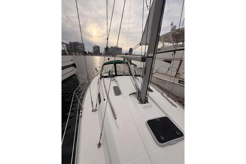 Slide: The Image of 1997 Beneteau Oceanis 351 sailboat docked at marina during sunset. - 15
