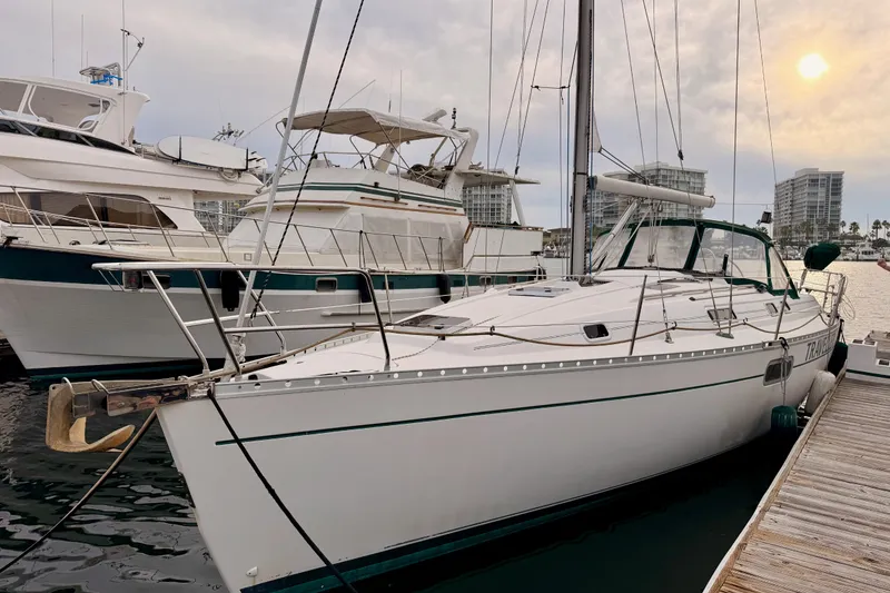 Slide: The Image of 1997 Beneteau Oceanis 351 sailboat docked at marina during sunset. - 2