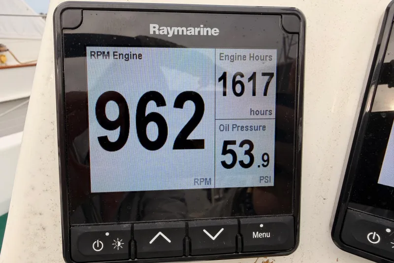 Slide: The Image of Raymarine display on 1997 Beneteau Oceanis 351 showing RPM, engine hours, and oil pressure. - 31