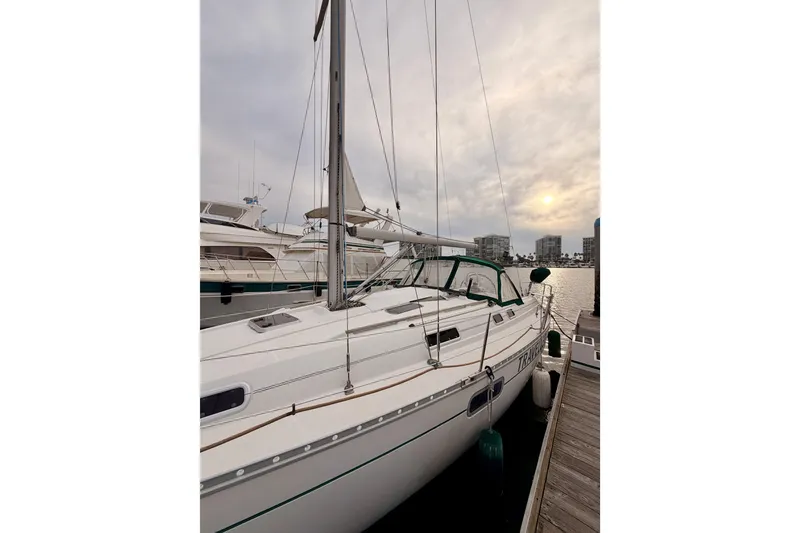 Slide: The Image of 1997 Beneteau Oceanis 351 sailboat docked at marina during sunset. - 4
