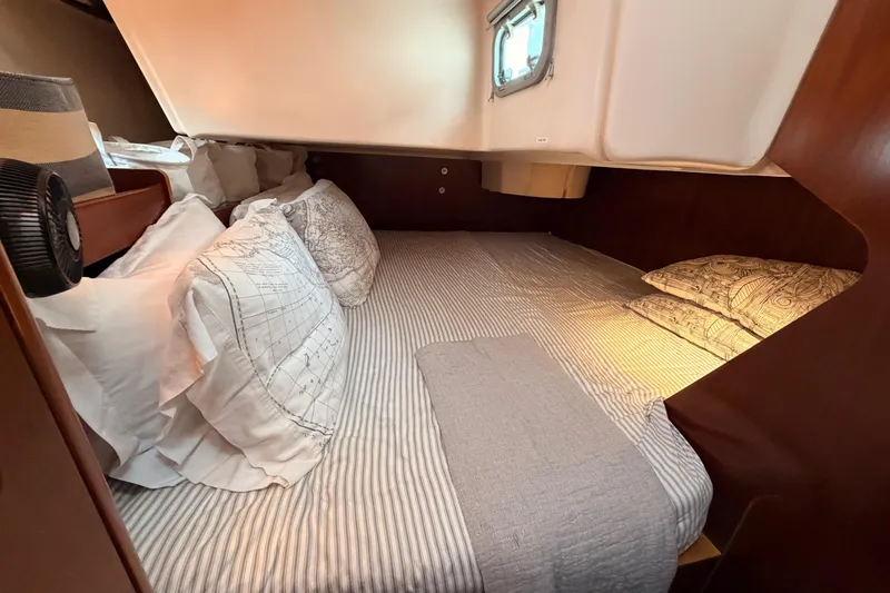 Slide: The Image of Cozy cabin interior of 1997 Beneteau Oceanis 351 sailboat with comfortable bedding. - 42