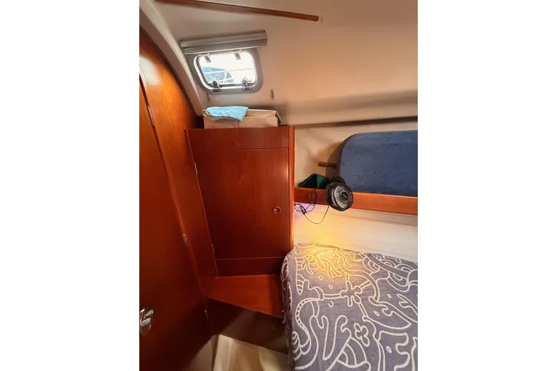 Slide: The Image of Cozy cabin interior of 1997 Beneteau Oceanis 351 sailboat with wooden cabinetry. - 58