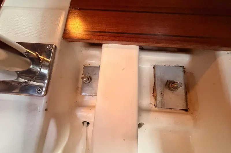 Slide: The Image of Interior detail of a 1997 Beneteau Oceanis 351 sailboat, showing metal fittings and wood trim. - 65