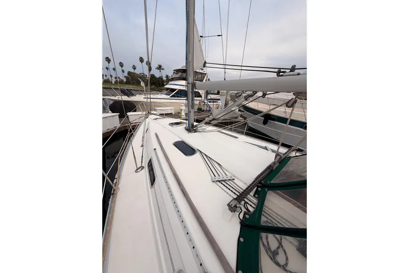 Slide: The Image of 1997 Beneteau Oceanis 351 sailboat deck view at marina. - 9
