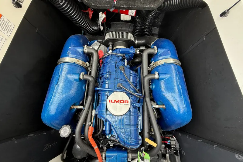 Slide: The Image of Ilmor engine in 2022 MasterCraft XT24 boat, featuring blue components and detailed piping. - 17