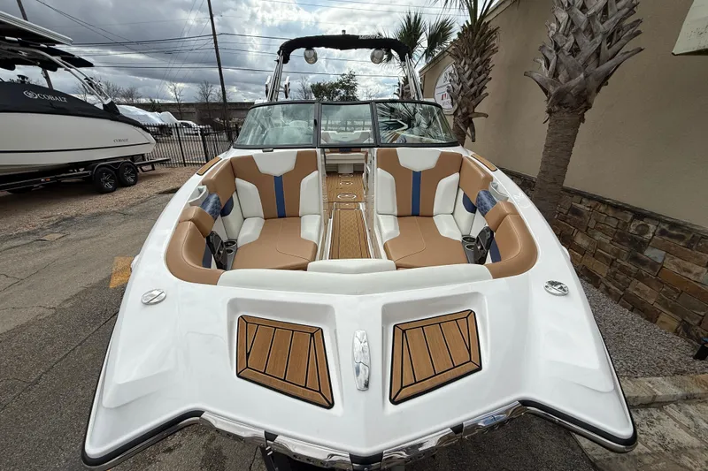 Slide: The Image of 2022 MasterCraft XT24 boat with luxurious seating and sleek design. - 2