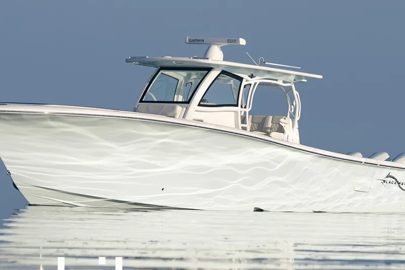 Slide: The Image of Blackwater 41 Performance Fish 2027 on calm water. - 2