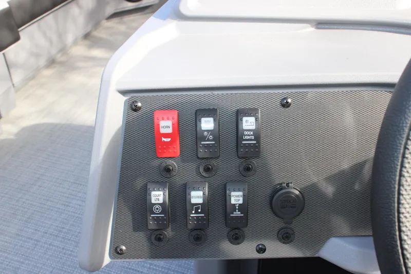 Slide: The Image of Control panel of 2026 Starcraft VX 22 R DH boat with various switches and buttons. - 12