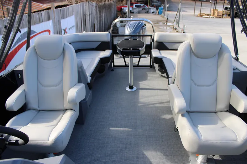 Slide: The Image of 2026 Starcraft VX 22 R DH boat interior with plush seating and modern design. - 13