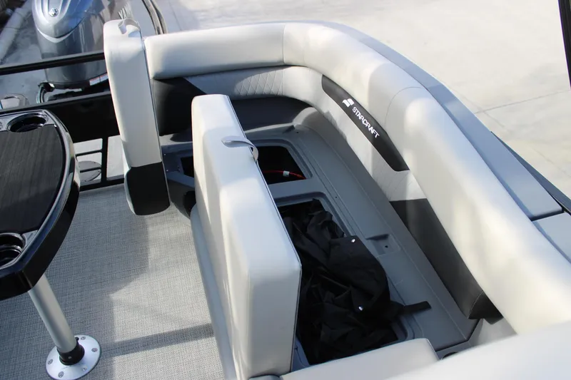 Slide: The Image of 2026 Starcraft VX 22 R DH boat interior with seating and storage compartment. - 16